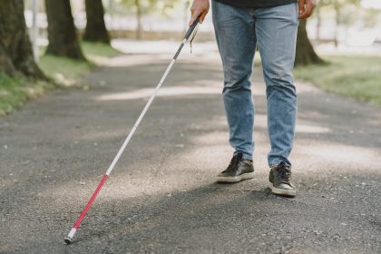 Blind disabled man walking with cane
