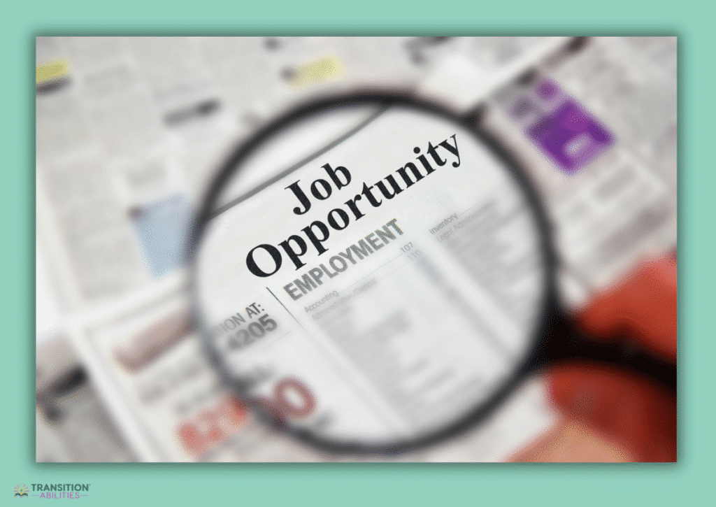 Magnifying glass over job opportunity newspaper listing