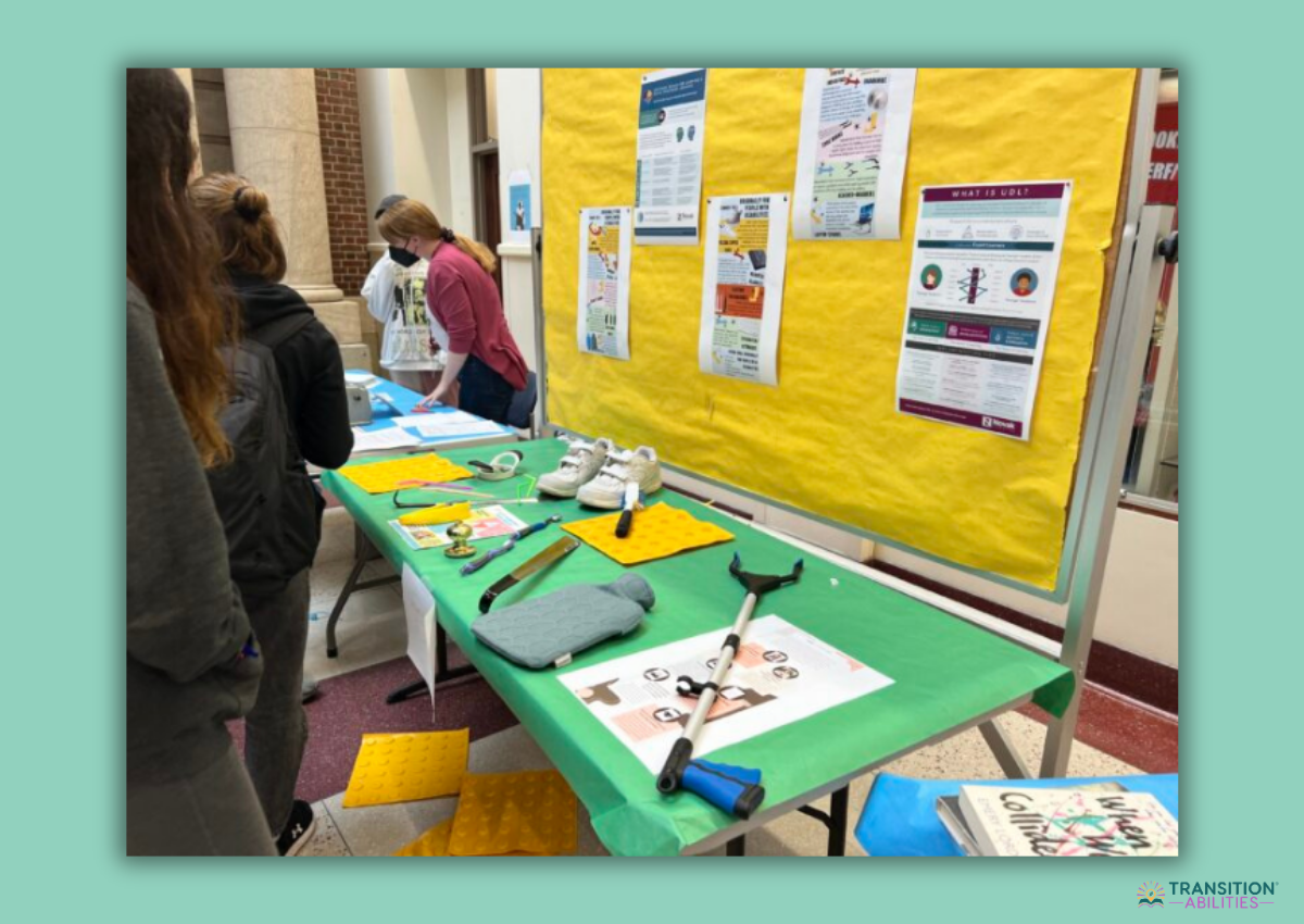 Students exploring exhibit table with adaptive tools