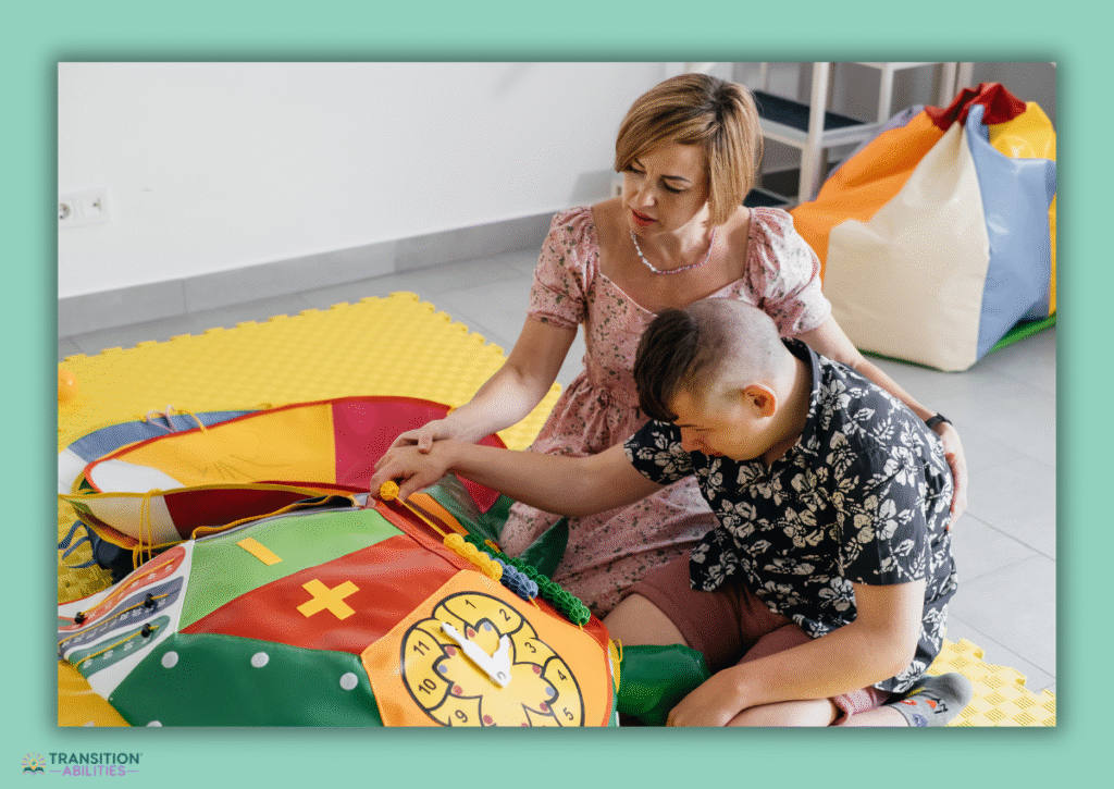 Adult supporting child during sensory activity with learning toy