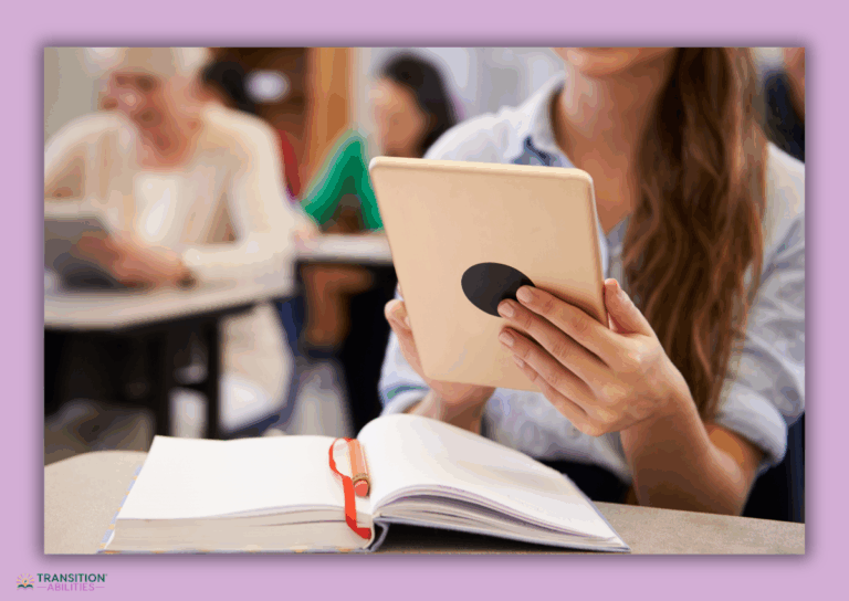 Student using a tablet with an open notebook on desk