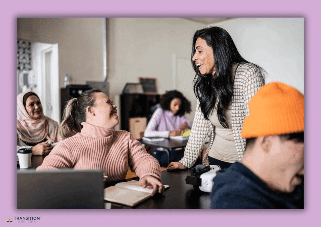 Teacher talking with smiling students in a classroom