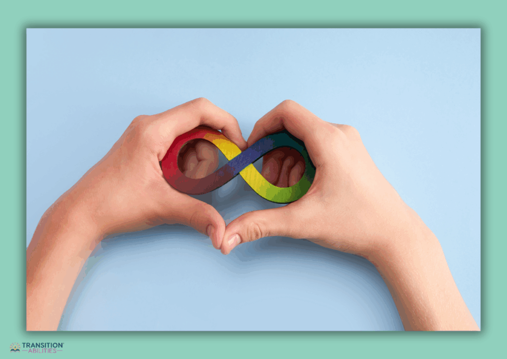 Hands holding a rainbow infinity symbol.