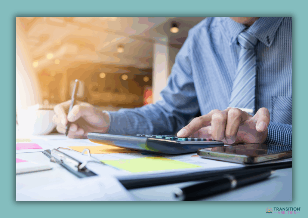 Person calculating finances with calculator and documents