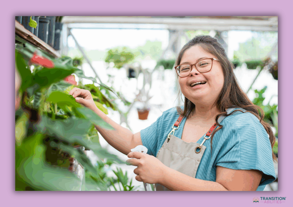 Woman watering plants in a greenhouse