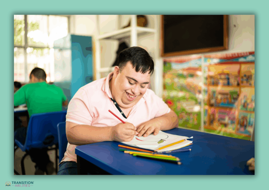 Student smiling while drawing at a desk in a classroom.