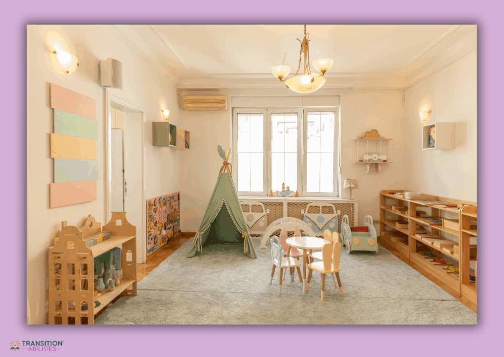 Classroom play area with small tables, toys, and a tent.