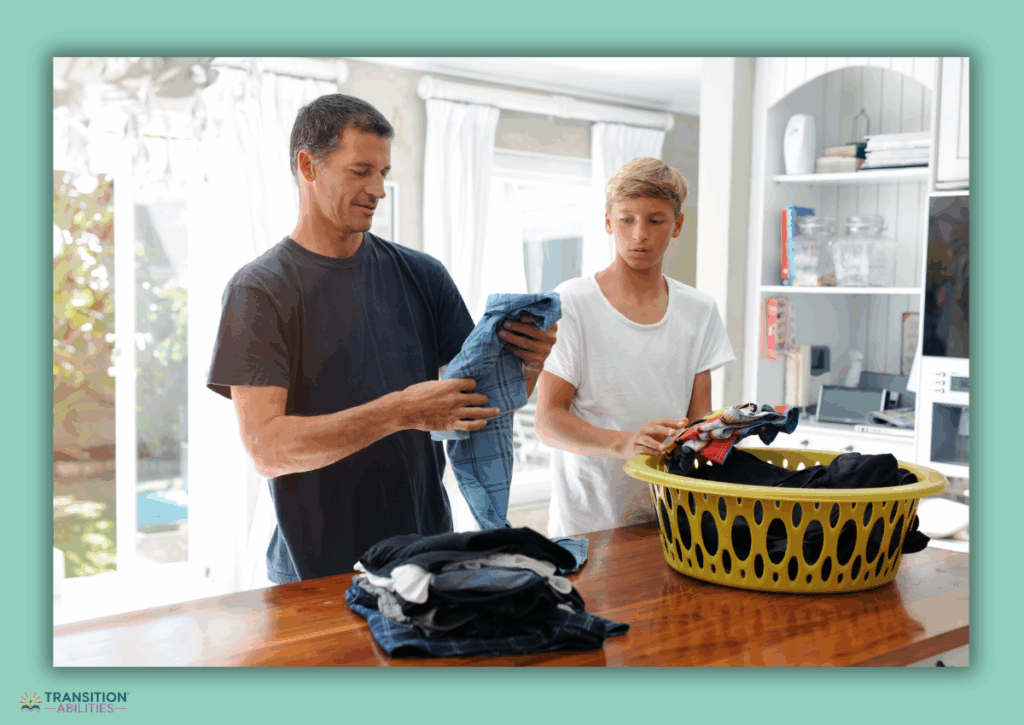 Adult and teen folding laundry together at a table