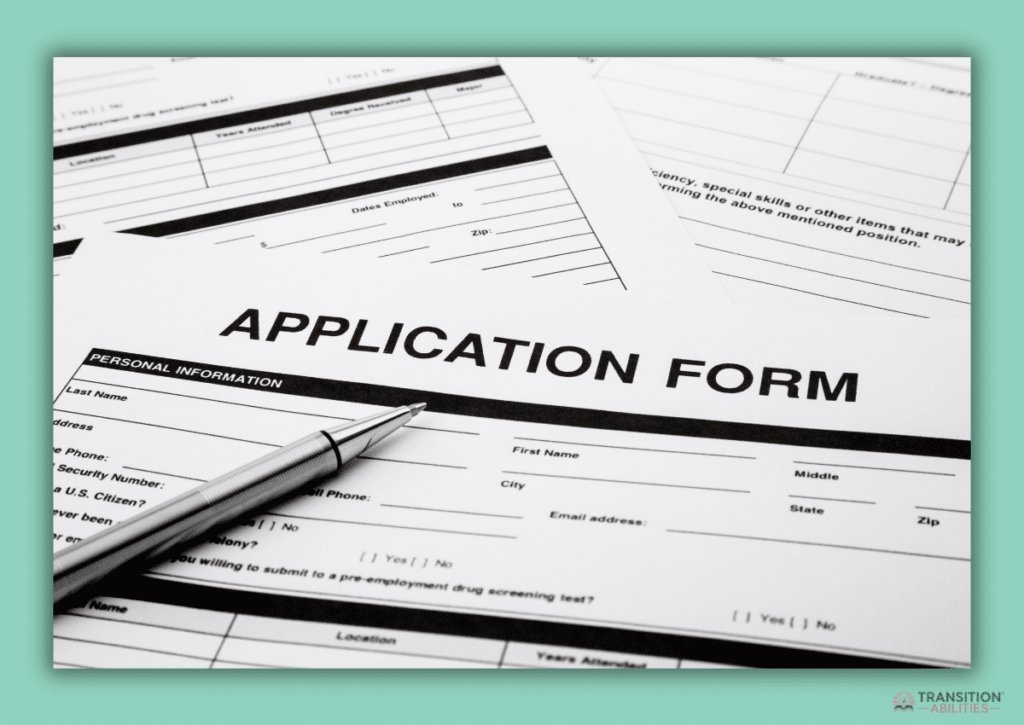 A close-up of a blank job application form with a pen on top.