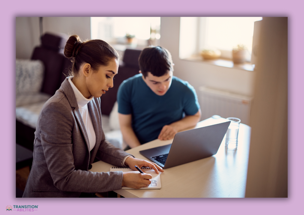 Teacher assisting a student with a laptop in a home or classroom setting.